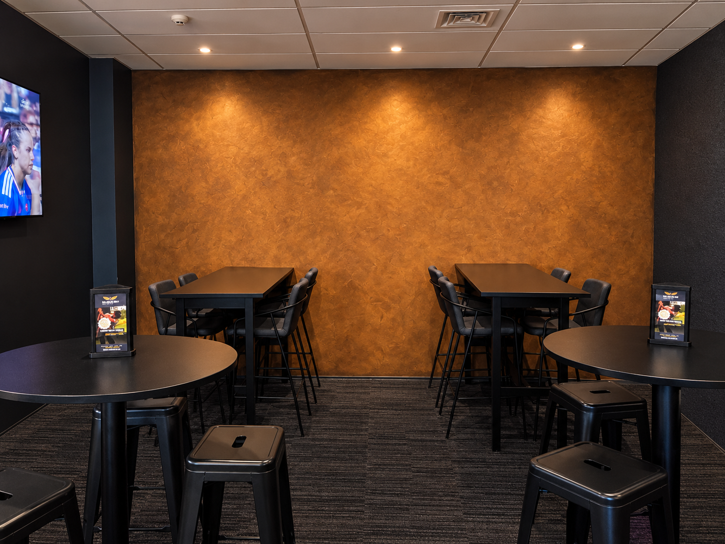 Finished cafe lounge with textured feature wall