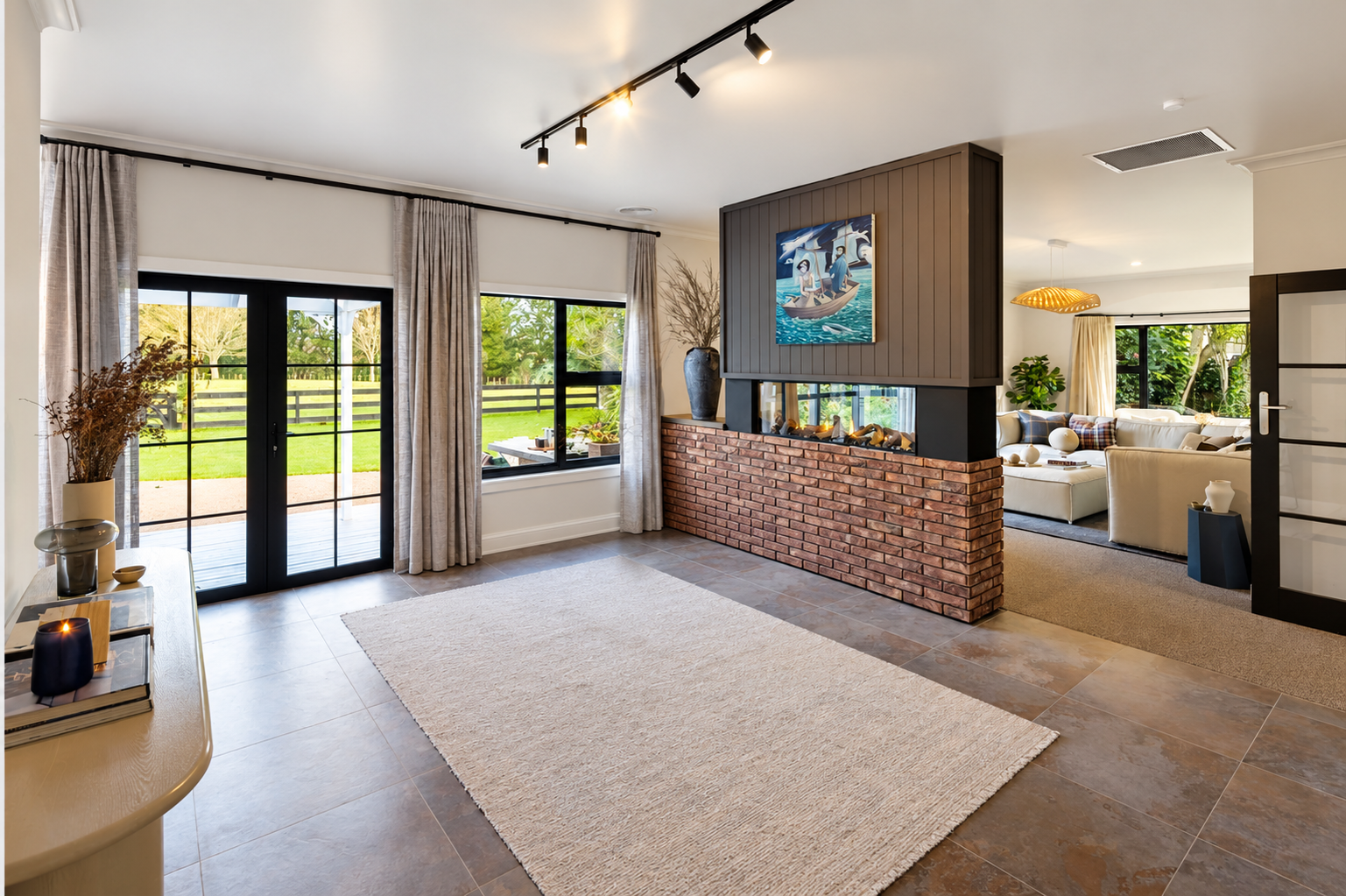Modern open-plan living room with brick fireplace